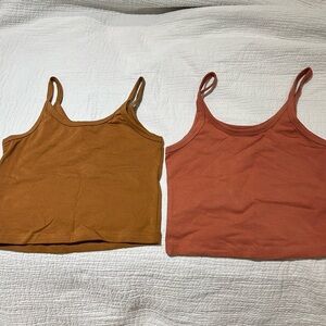 Set of two ARQ tanks. Never worn. Size S. Terracotta and Caramel